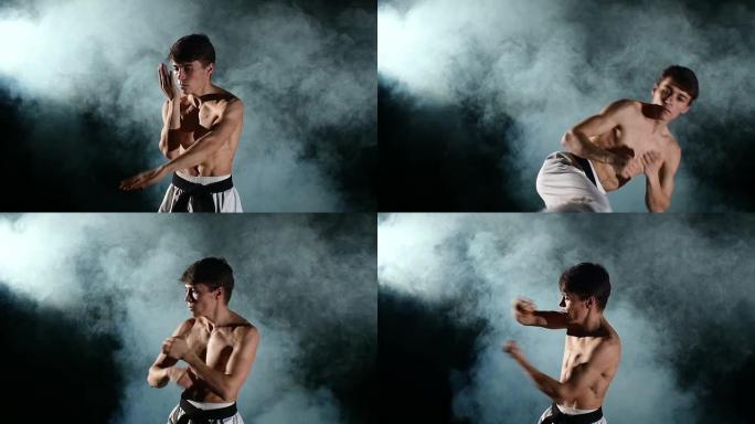 训练跆拳道或空手道的男子，上身赤裸，带黑带，抽烟，慢动作