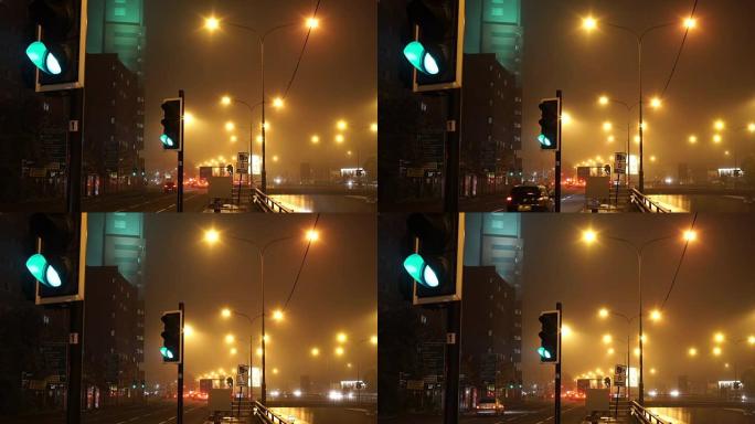 夜间，雾蒙蒙，城市交通路口。