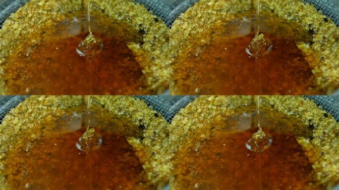 过滤新提取物蜂蜜。蜂蜜旋转器提取和过滤生蜂蜜。