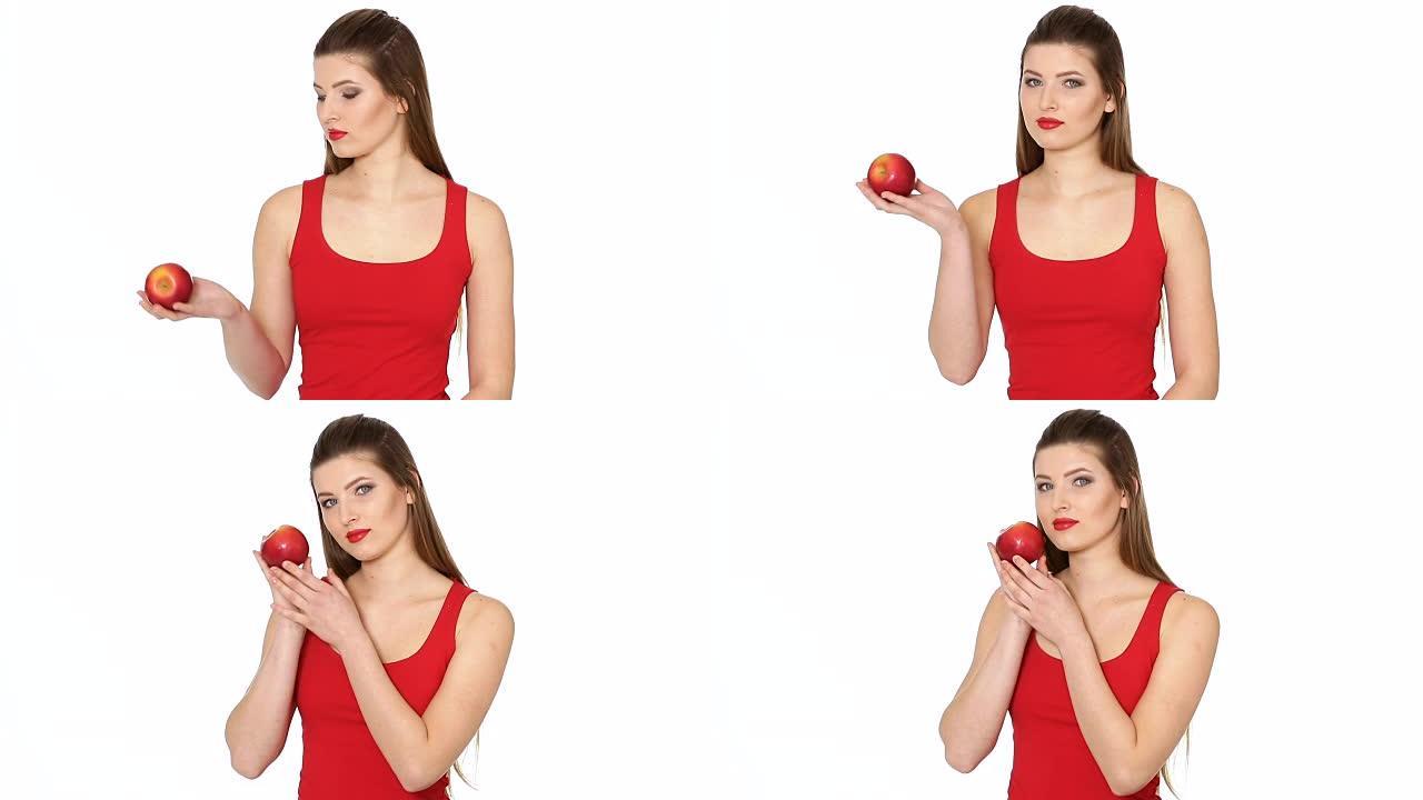女人拿着红苹果，在白色背景上微笑