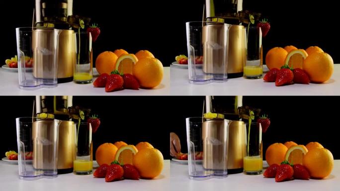 多莉: 使用咀嚼榨汁机用草莓和橙子制成新鲜果汁