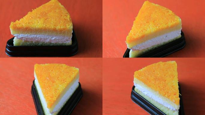 吃一片橙色蛋糕。