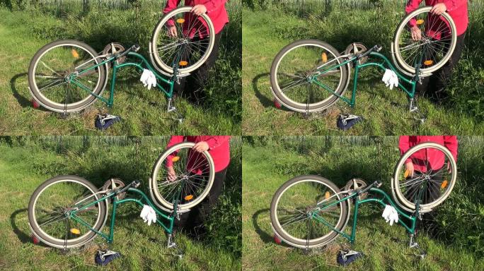 修理院子草地上的旧自行车