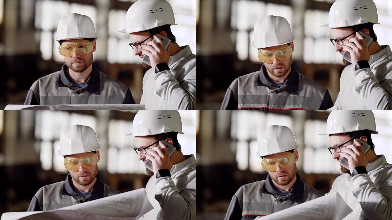 戴着防护头盔的工头和建筑师通过手机给客户打电话给项目客户，以更改施工计划