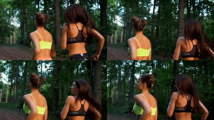 两个健身女孩在树林里跑步。他们践行运动生活方式。为了健康和调剂