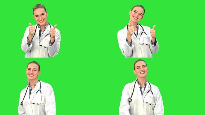 年轻的医生女人的肖像微笑着，竖起大拇指，看着绿色屏幕上的听诊器和实验室外套的相机，色键