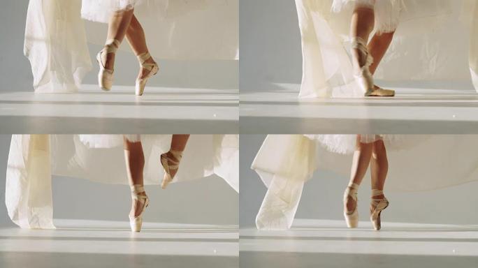 白色工作室古典芭蕾舞女演员的剪影。