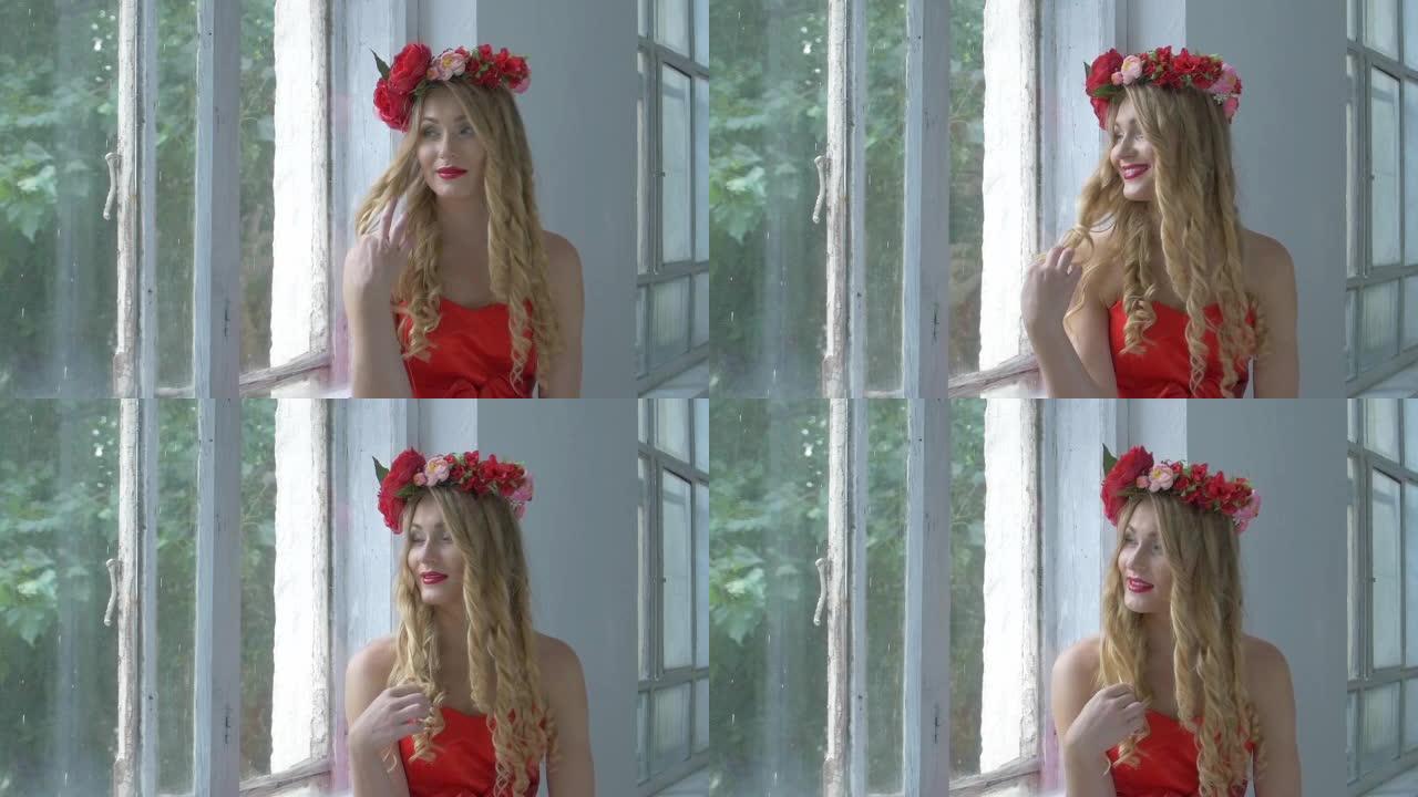 漂亮的年轻女子头上戴着红花花环坐在窗台上，微笑着，慢动作