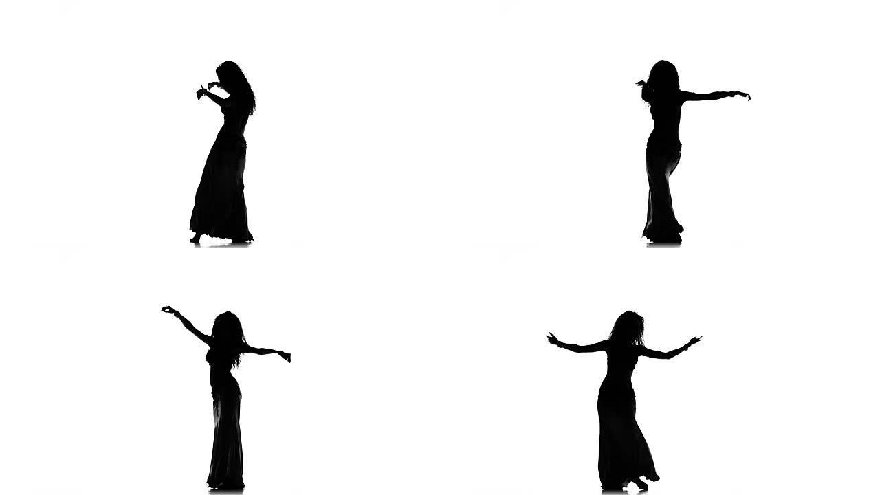 异国情调的肚皮舞女人在白色上跳舞，剪影