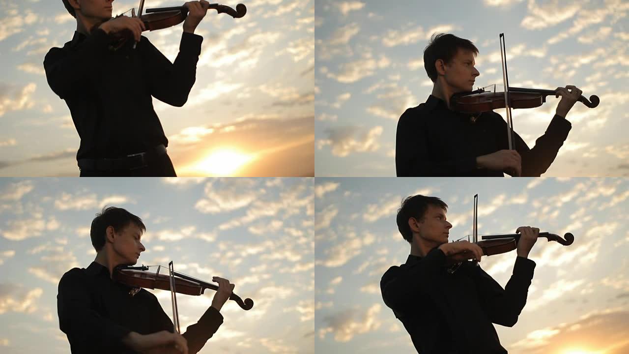 小提琴手在夕阳下演奏。日落小提琴