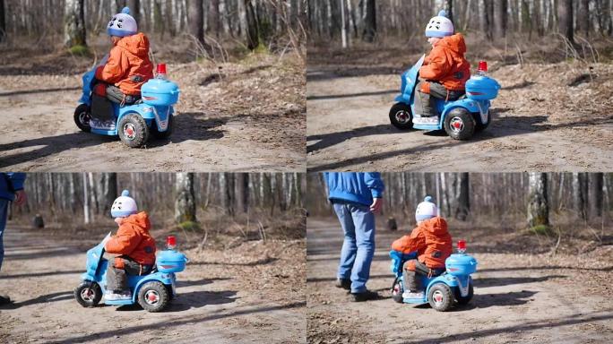 一个快乐的孩子骑电动车