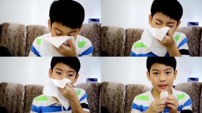 患有流感的亚洲小孩打喷嚏并用薄纸清洁