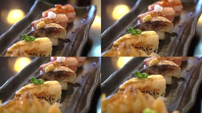 Aburi nigiri套装或烤寿司套装。日本食物，生鱼快速燃烧