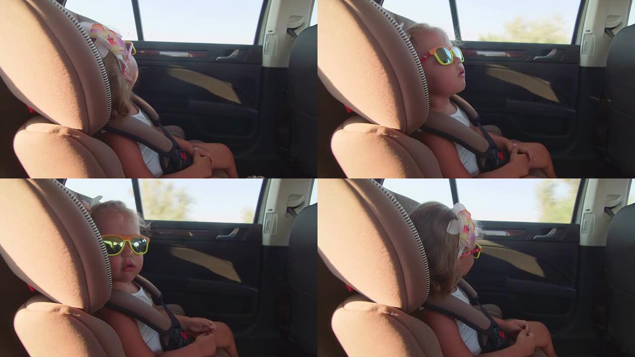 带安全带的车载儿童前向座椅载着小女孩乘客