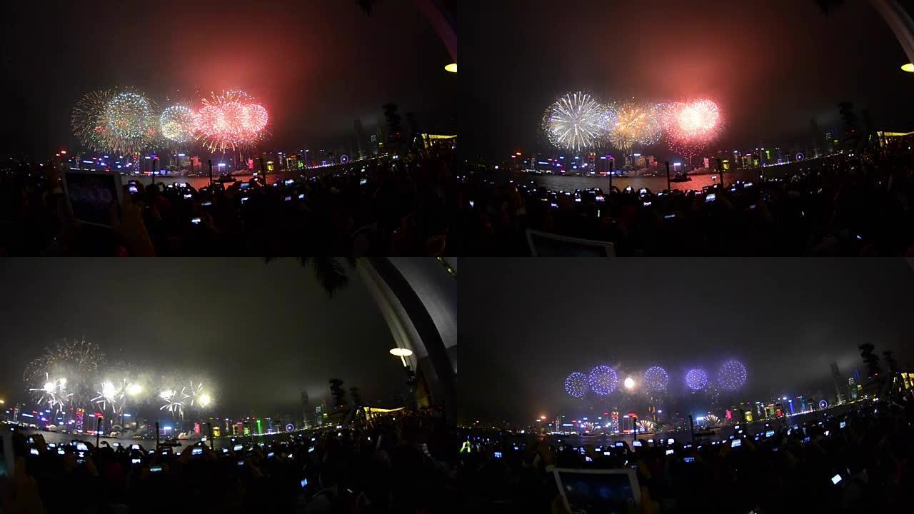 广州观看烟花的人群。广州节日的烟花。广州市烟花在中国广州的灯光效果开幕之夜