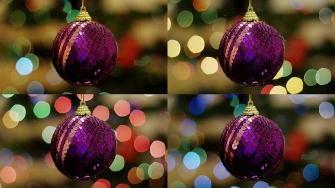 背景bokeh的圣诞节紫色球摇晃