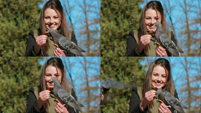 快乐的女孩正在喂鸽子