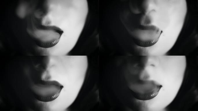 4k特写的女人嘴与烟，黑色和白色