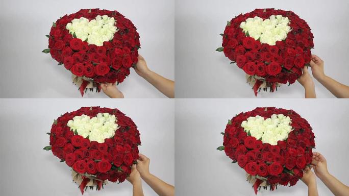 红玫瑰花束内有心形的白玫瑰