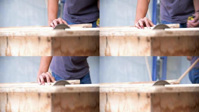 木匠用圆锯切割木板。