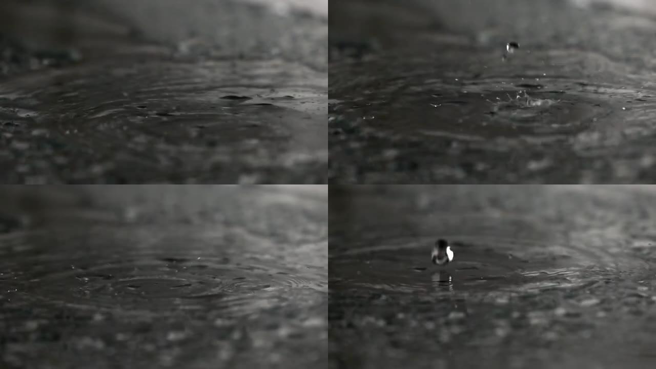 水滴撞击湿玻璃表面的超慢动作镜头