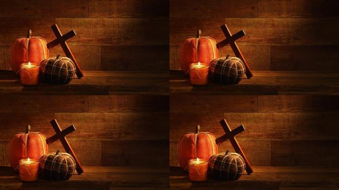 秋季木制背景，蜡烛和刺绣南瓜
