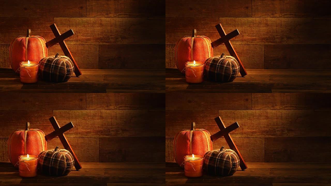 秋季木制背景，蜡烛和刺绣南瓜