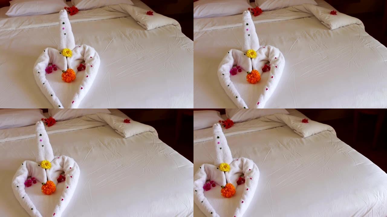 浪漫的酒店客房配有天鹅毛巾