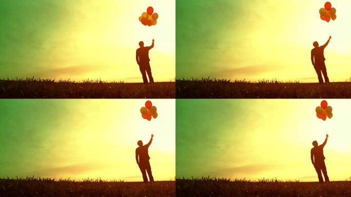 孤独的人拿着气球希望升起的太阳信念概念