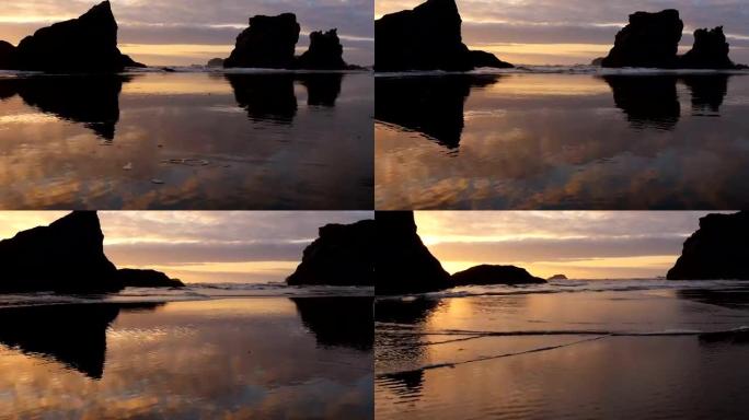 俄勒冈州海岸日落时的海浪和岩层
