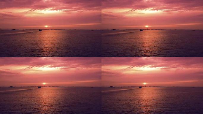 平静宁静的风景美丽的天空有火红的云，黎明时船移往港口