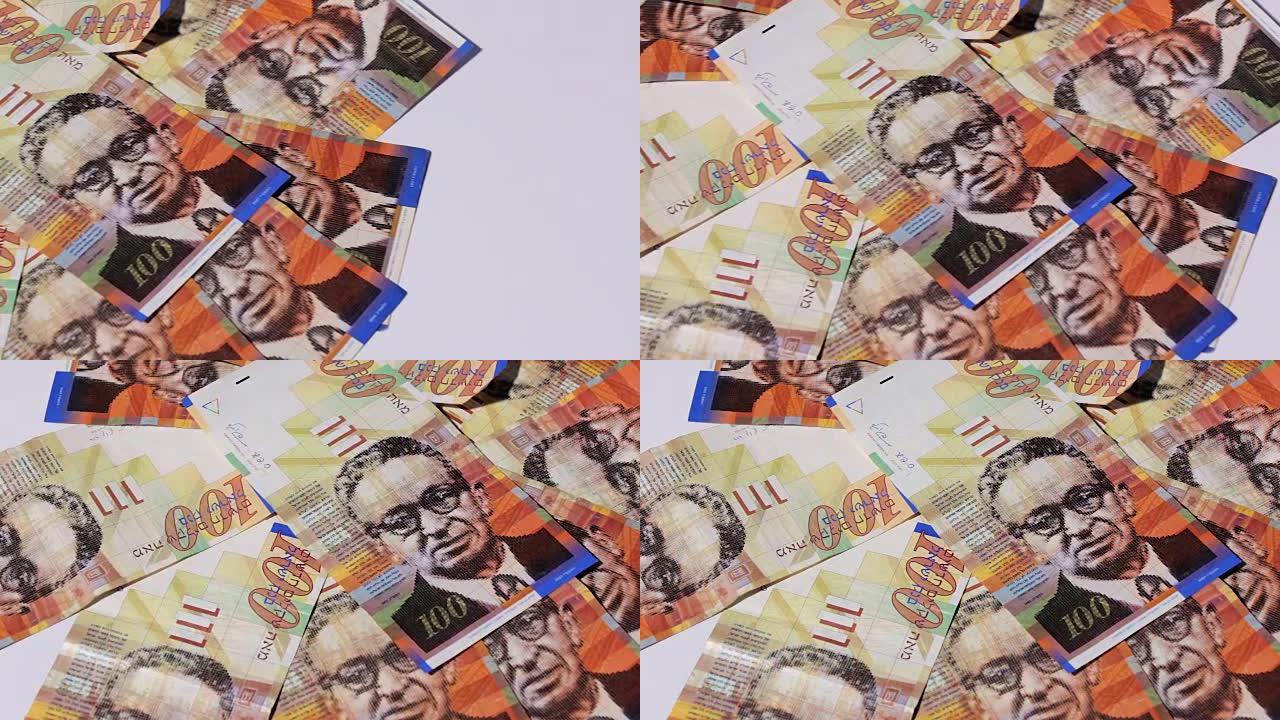 一堆100谢克尔-潘的以色列钞票