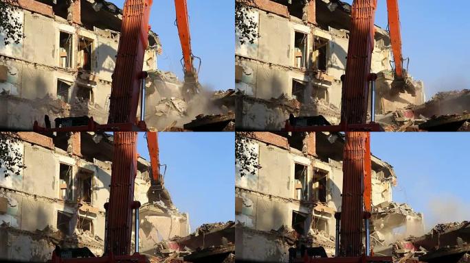 液压破碎机挖掘机机械正在拆除老房子。俄罗斯莫斯科