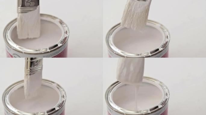 油漆刷浸入油漆罐中