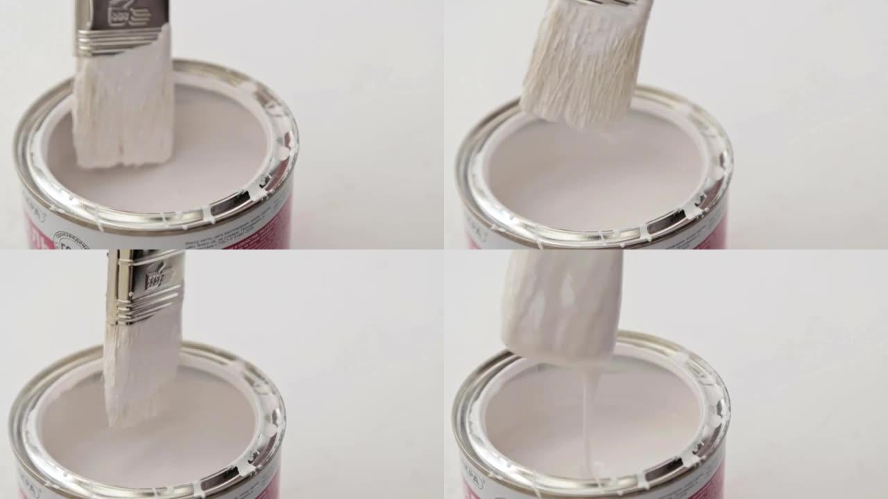 油漆刷浸入油漆罐中