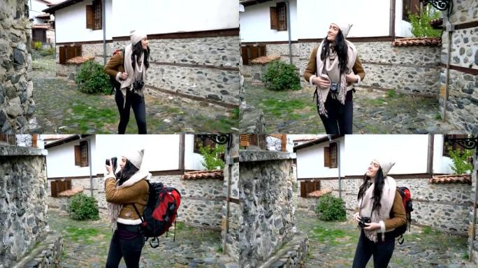 在Zlatograd小村庄散步的女游客