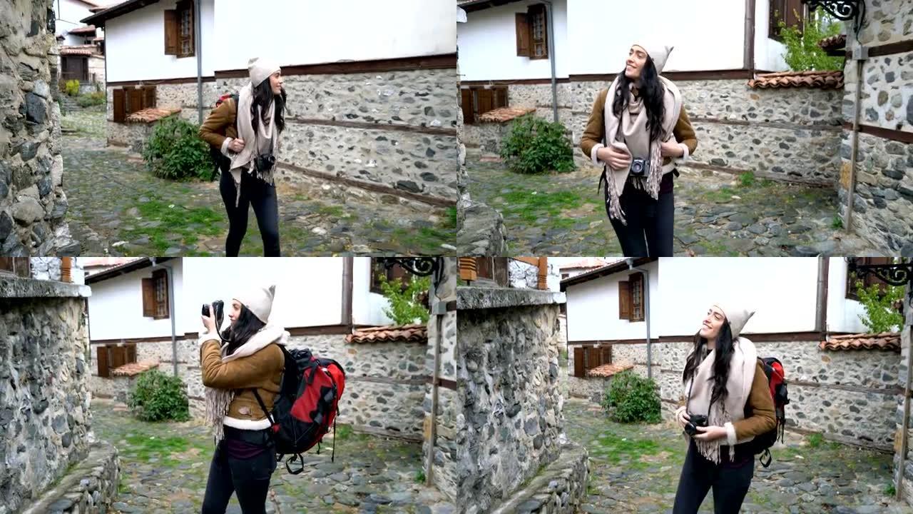 在Zlatograd小村庄散步的女游客
