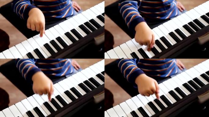 男孩在学弹钢琴