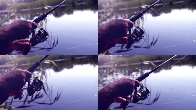 一名男子用鱼竿钓鱼的色调饱和镜头