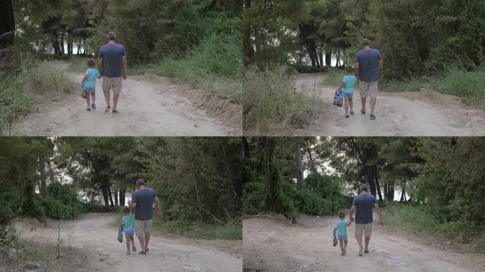 孩子和爷爷一起穿过树林