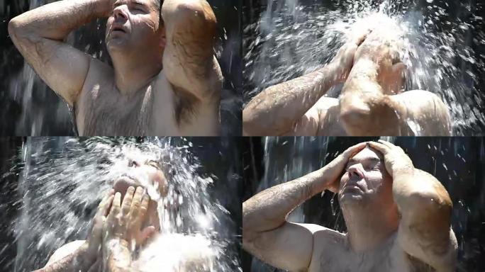成年男性在瀑布上沐浴慢动作