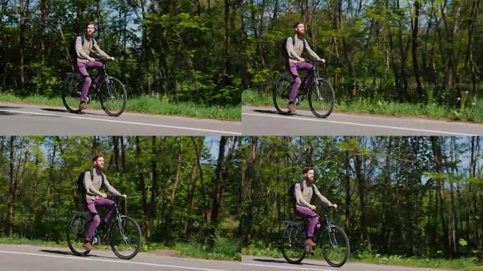 一个留着胡子的男人正在骑自行车。在绿色森林生态旅游的背景下，一种环保的交通方式