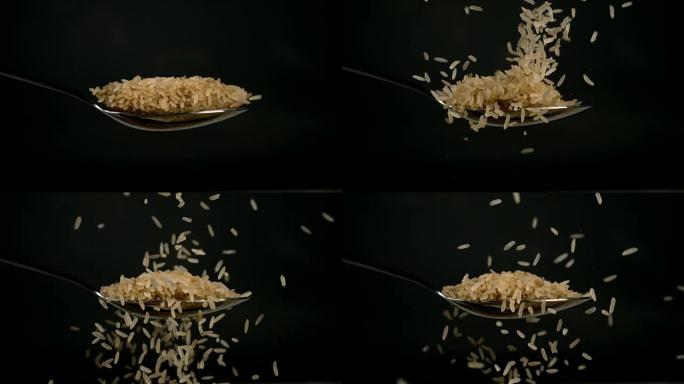 大米落在黑色背景下，慢动作4K