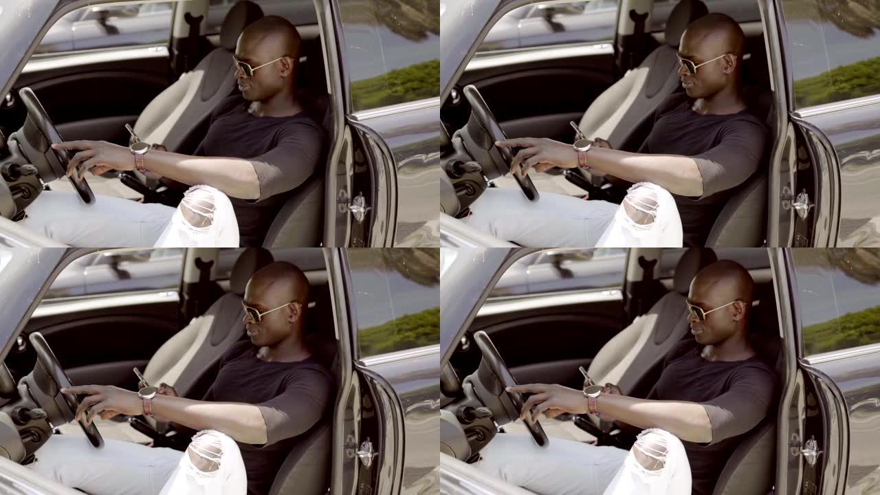非洲男子开车检查手机