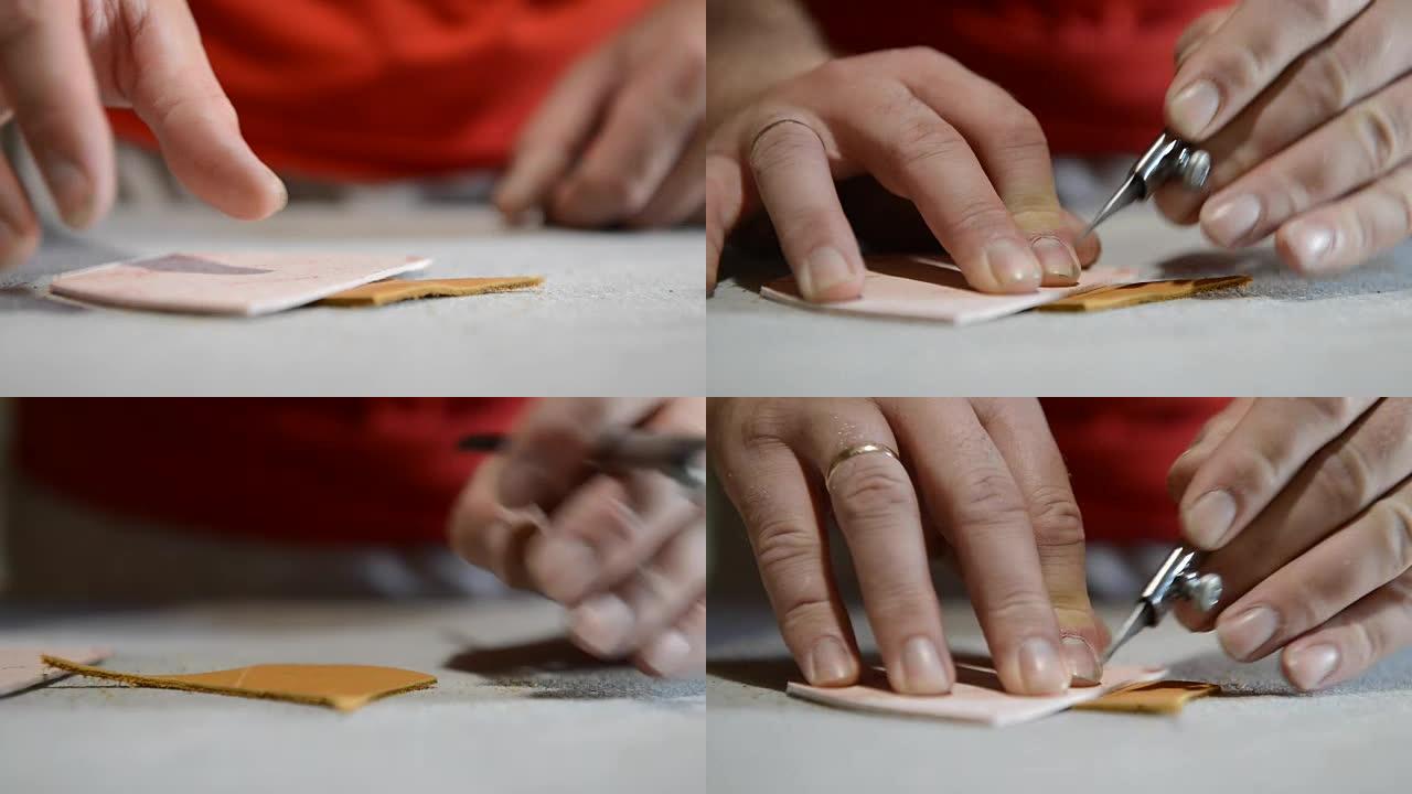 鞋匠在纸上制作图案并切割皮革
