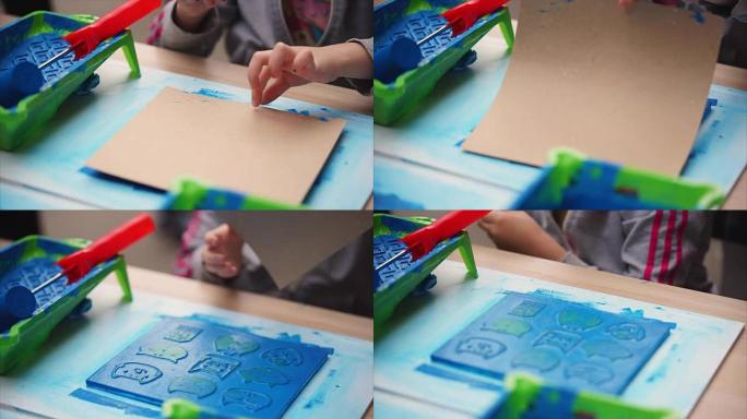 儿童用纸板上的橡皮图章画蓝猫。