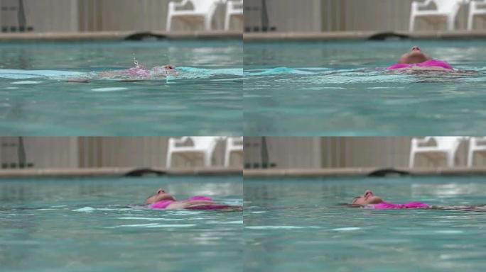 漂浮在游泳池里的女人