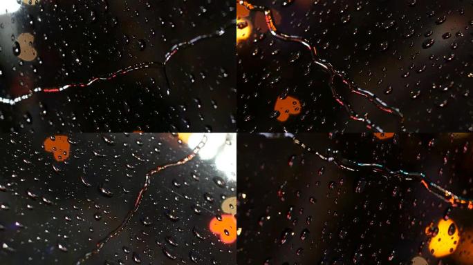 360旋转视图的焦点心脏在雨滴后面跳舞。