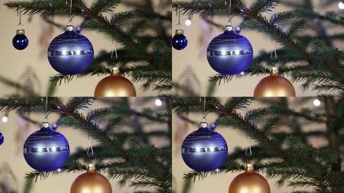云杉树枝上的圣诞球背景闪光灯。