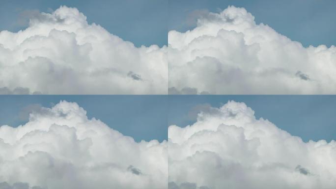 概念云如山。夏天，白色蓬松的棉云穿过蓝天。任何想法的良好背景